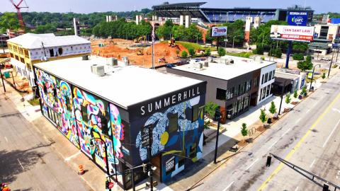 A drone view of Atlanta's Summerhill neighborhood with a giant stadium. 