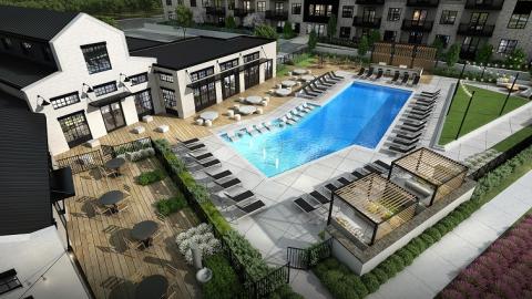 Rendering of a pool area around a barn-like structure and apartment complex. 