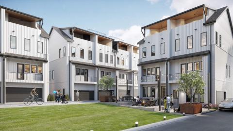 A view of a courtyard with grass in a new townhome development in Atlanta, in renderings. 