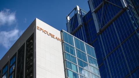 A photo of two large buildings under blue skies in Atlanta. 