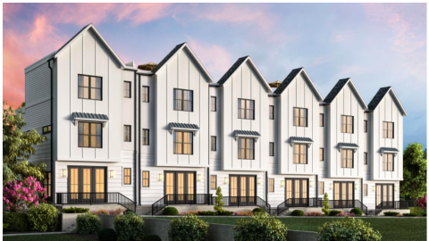 A rendering of a row of white townhomes under pink and blue skies. 