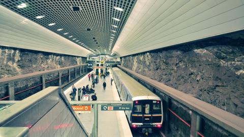 A photo of a train station in downtown Atlanta with stone walls. 