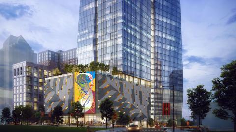 A rendering for a huge glassy development in downtown Atlanta under blue-gray skies. 