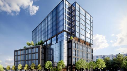 A rendering of a glassy mid-rise office building with wood interiors under blue skies. 
