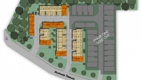 An image of a pocket of townhomes near trees under construction in Atlanta. 