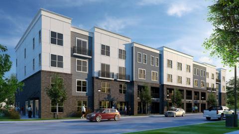 A rendering of a white and brick development under blue skies surrounded by trees. 