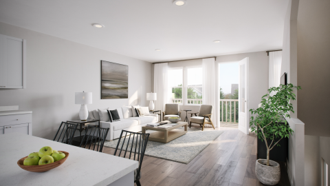 An image showing the white interiors of new townhomes in Atlanta with a sunny day outside. 
