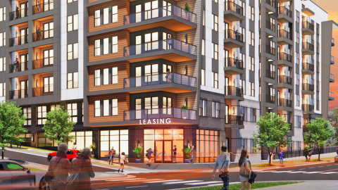 A rendering of an apartment complex shown on a busy street in Atlanta. 