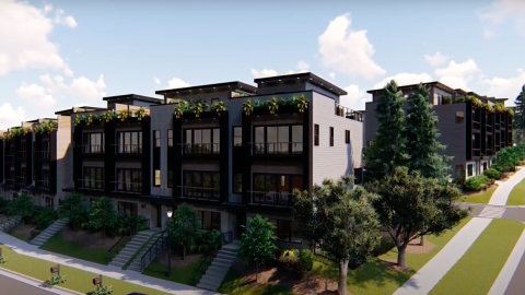 A rendering of a huge modern townhome complex under blue skies near Atlanta with pine trees and grass around. 