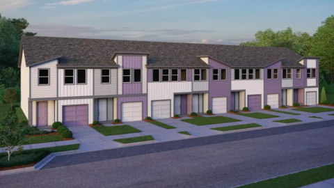 A rendering of the exterior of a colorful townhome project with white exteriors and garages.
