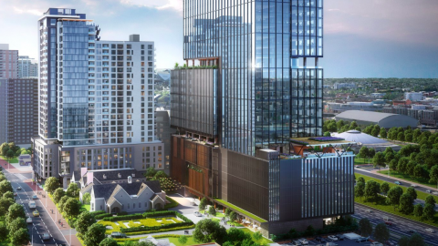 A rendering of two large towers in downtown Atlanta surrounding an old stone church. 