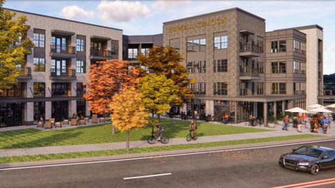 A rendering of a large brick and stucco apartment complex under blue skies, painted brown and white.