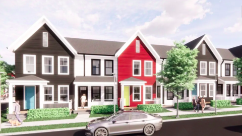 A rendering of a row of brightly colored townhomes in Atlanta under gray-blue skies.
