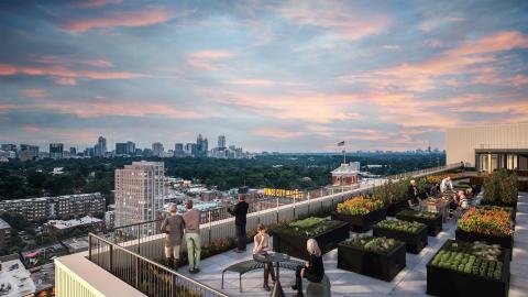 A rendering of a new large building overlook Atlanta with pink-blue skies overhead. 