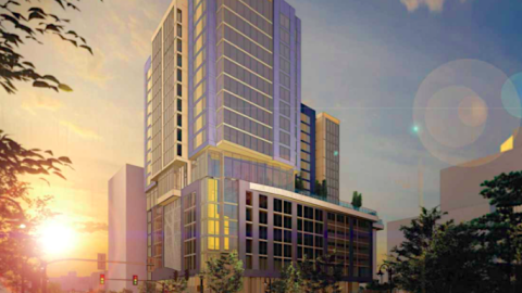 A rendering of a large new hotel tower under gray-orange skies. 