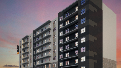 A rendering of a tall white and black building under pink skies.
