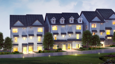 A rendering showing a row of duplexes under blue gray skies in Atlanta at night. 