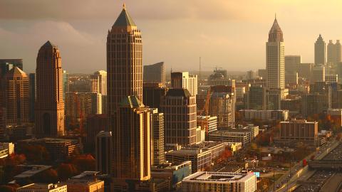 A photo of a skyline in a sunset during golden hour. 