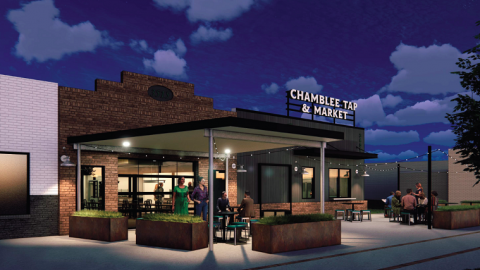 An image showing how a taproom and food hall will be made from old brick buildings under blue purple skies.