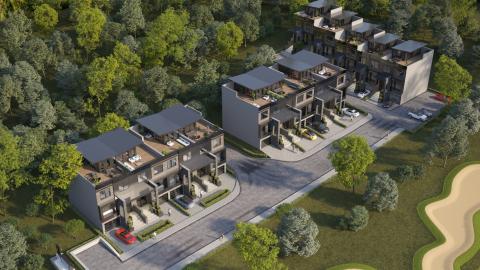 An image fo a site where 13 modern townhomes are being built near a large golf course in Atlanta. 