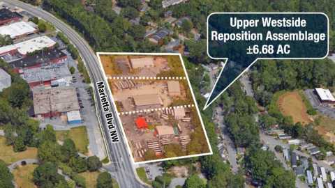 An overview of a site where hundreds of apartments and townhomes are being planned in west Atlanta near a wide street.