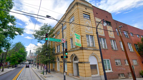 An image of a downtown Atlanta building near a streetcar line where a rehab is planned.