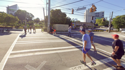 An image showing a point where a wide BeltLine path crosses a busy street in Atlanta. 