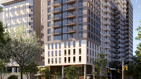 A rendering of a tall building under blue skies near a grassy park. 