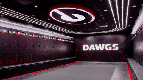 A red and black modern new locker room facility with Nike and UGA branding and gray carpets.