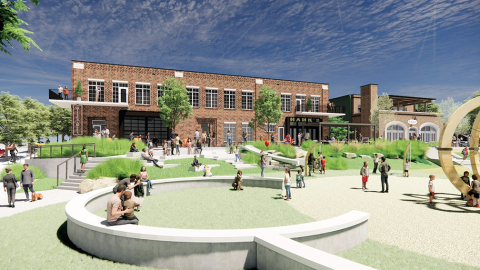 An image showing a site beside a park where a brick and yellow building will be built for retail and restaurants. 
