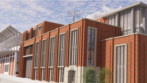A rendering showing a large brick addition to a football stadium in gray under blue skies with clouds.