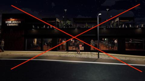 An image of a new restaurant building at night with a large X in the middle. 