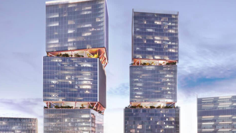 A rendering showing four new glassy lighted buildings standing over an Atlanta transit station, under blue gray clouds.