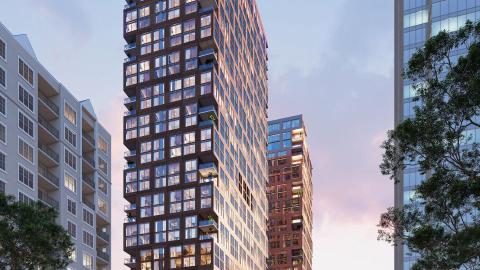 A rendering showing two large buildings under blue skies near wide roads. 