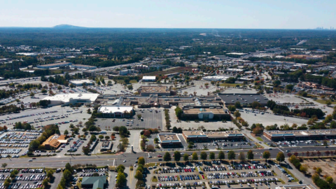 An image showing conditions around a large suburban shopping mall outside Atlanta with many wide roads and commercial buildings around it.