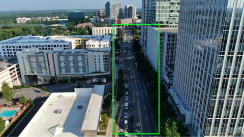 An overview of a large complete street project now underway in Atlanta near tall buildings and a wide road with many lanes.