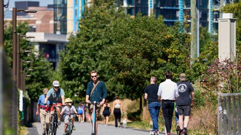 A photo of people biking walking and roller blading along a paved concrete path in Atlanta.