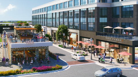 A rendering of a new office district next to a trendy restaurant building under blue skies. 