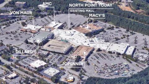 An aerial of a dated mall with big-box retailers in Atlanta's suburbs. 