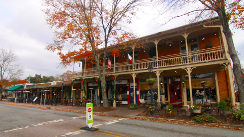 An image showing a long row of historic storefronts in a suburban Atlanta city. 