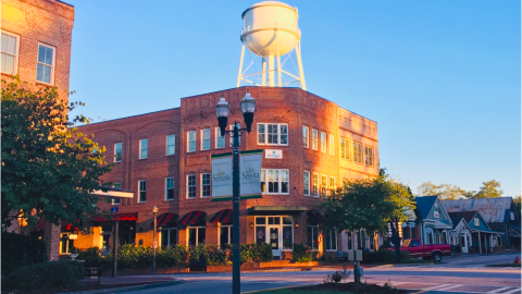 An image of a town where a huge home development is proposed about 40 miles south of downtown Atlanta, with many wooded acres near the small downtown today.