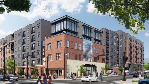 A photo of a corner in Atlanta with a large empty building on it where a large development is planned.