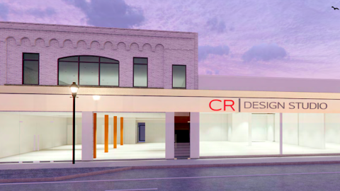 An image showing a row of shops with new modern exteriors under blue purple skies near a wide street in Atlanta.