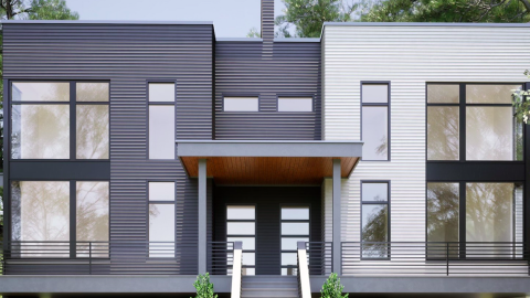 An image of a large duplex project being built under blue-gray skies in Atlanta's Reynoldstown neighborhood. 