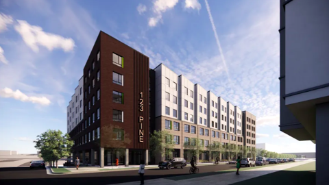 A rendering of a short multifamily building with brown gray and white exteriors under a blue sky in Atlanta.