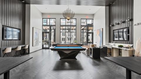 A photo showing a modern-style new apartment building in Atlanta with gray and white interiors. 