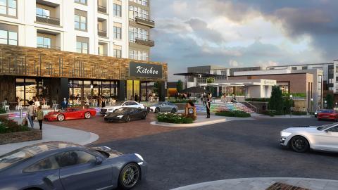 A rendering of a motorcourt with many new car and buildings near a fancy restaurant.