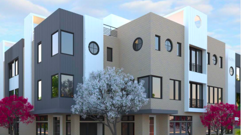 A photo showing a modern european style townhome project coming together under blue skies north of Atlanta.