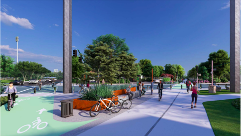 A rendering of a new trail shown crossing a busy street into a large park under blue skies in Atlanta. 