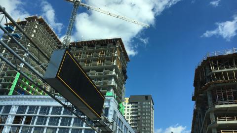 A photo under blue skies showing several news skyscrapers being built in Midtown Atlanta.